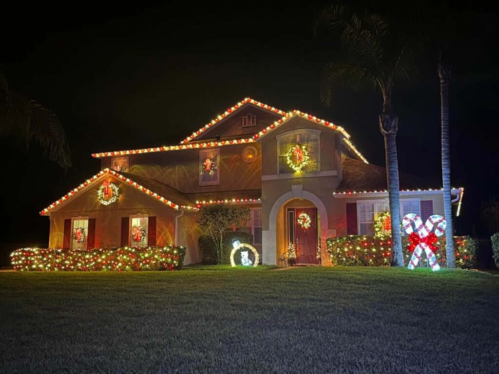 exterior doors and windows with lighted wreaths for Christmas