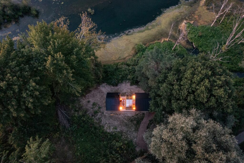 Top view of Cabin ANNA designed by Caspar Schols poised in middle of forest 