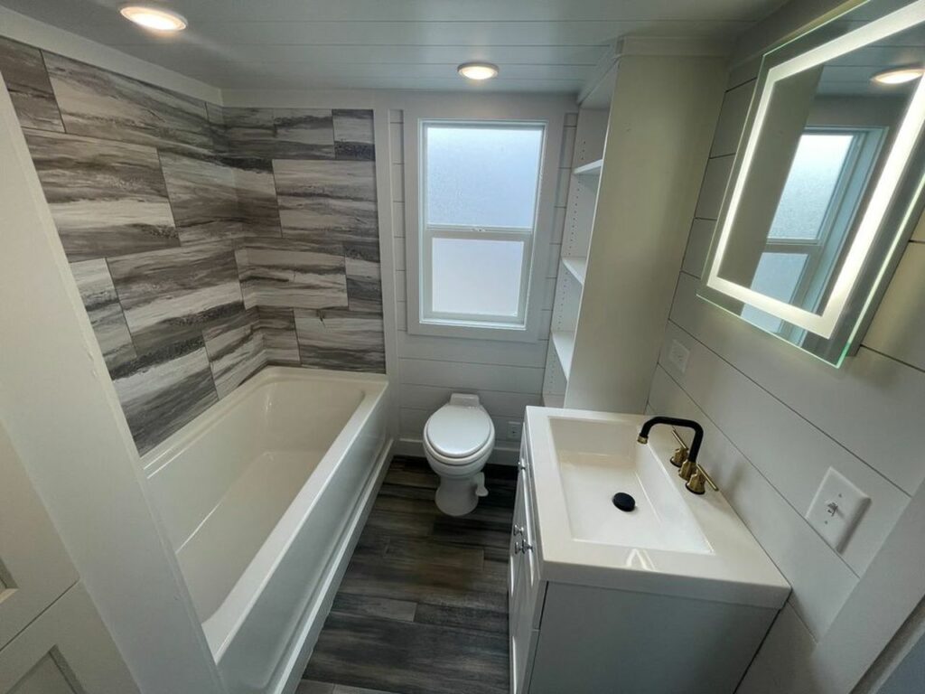 Kenai tiny house bathroom with loft kitchen