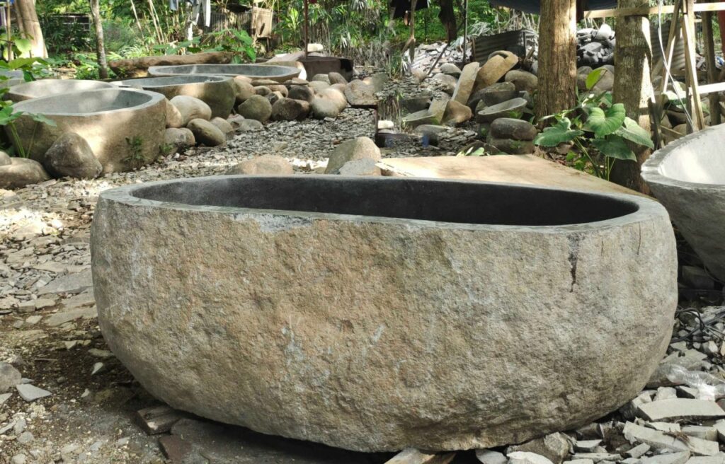 Natural stone bathtub by Paradise Living Co