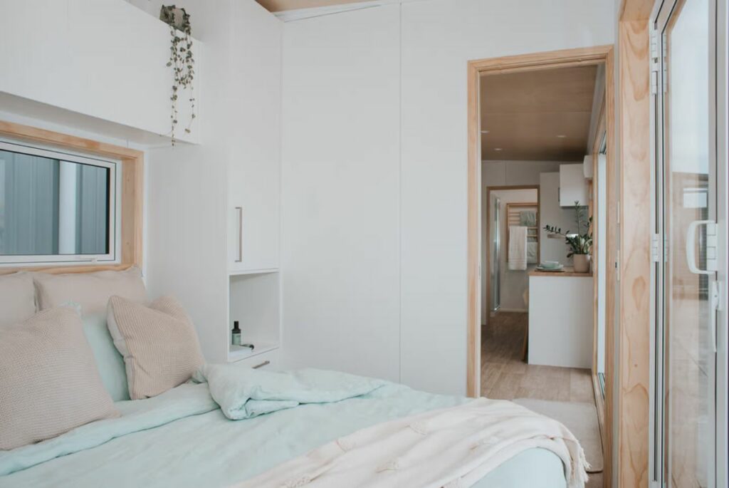 Kotuku tiny house on wheels with bedroom by Build Tiny