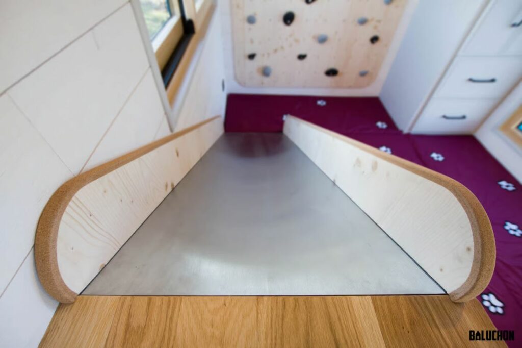 Baluchon's House of Happiness tiny house on wheels features a slide