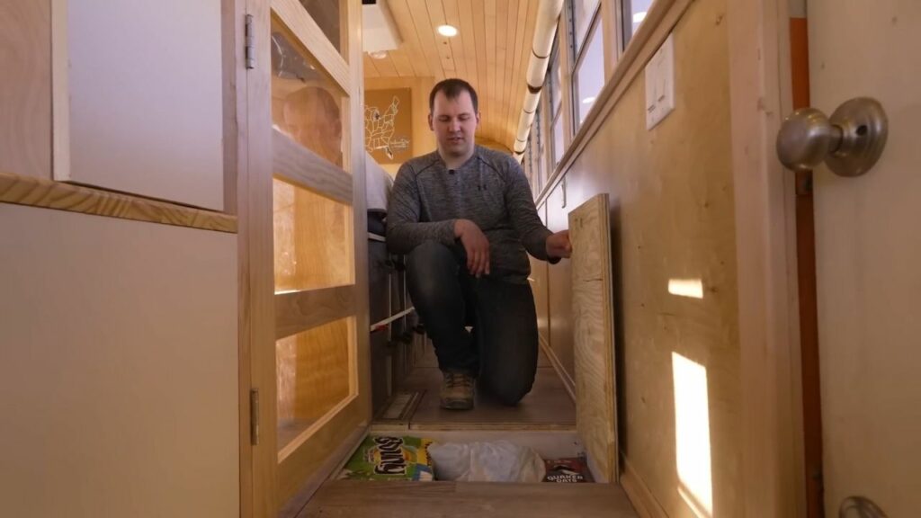 Couple Turns 40-ft School Bus into Luxury RV with Large Pantry in Kitchen