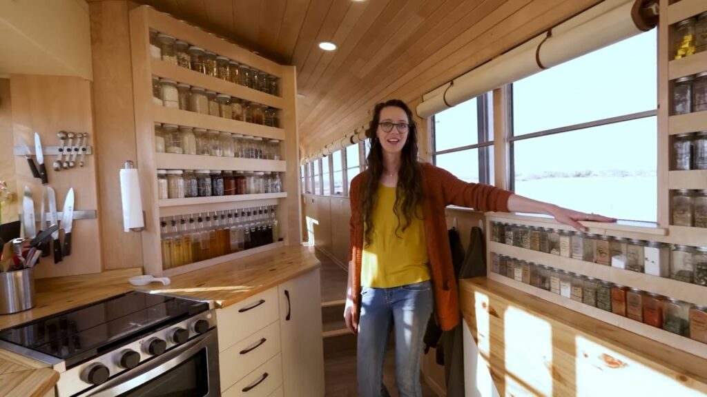 Couple Turns 40-ft School Bus into Luxury RV with Large Pantry in Kitchen