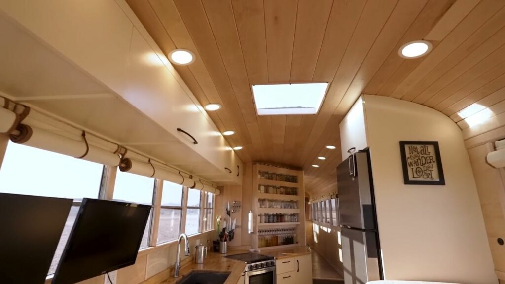 Couple Turns 40-ft School Bus into Luxury RV with Large Pantry in Kitchen