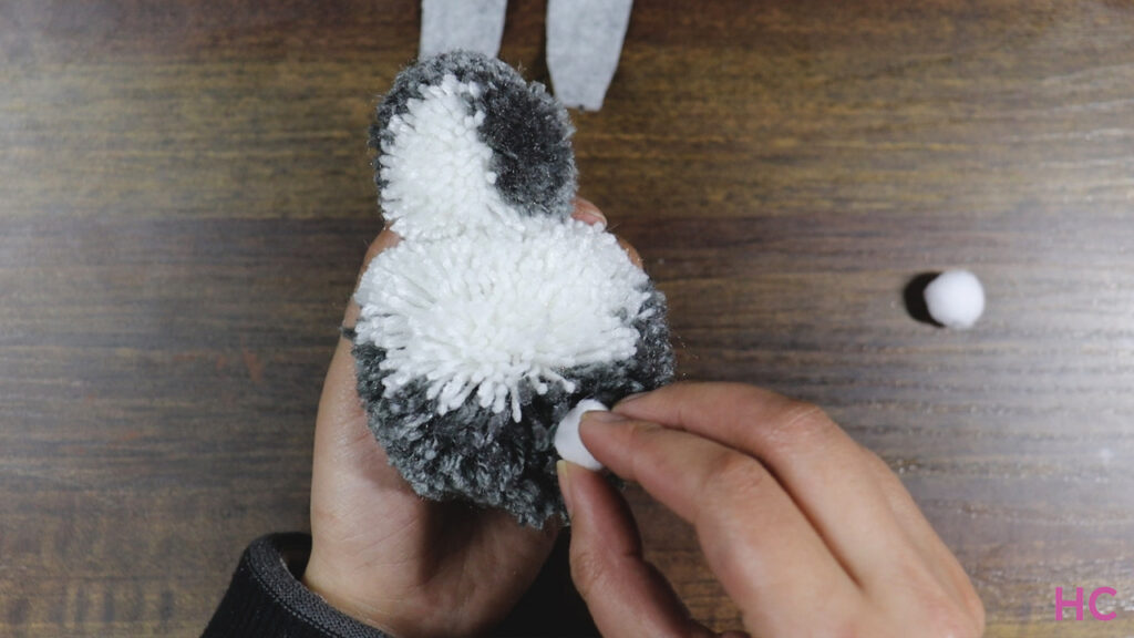 Glue-two-white-pom-poms-to-make-feet-and-one-at-back-for-poofy-tail