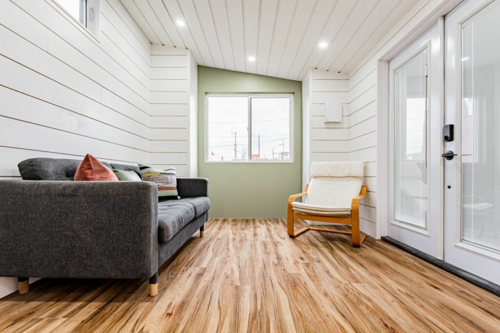 Raised living room of the Pine Needle Tiny House by Acorn Tiny Homes