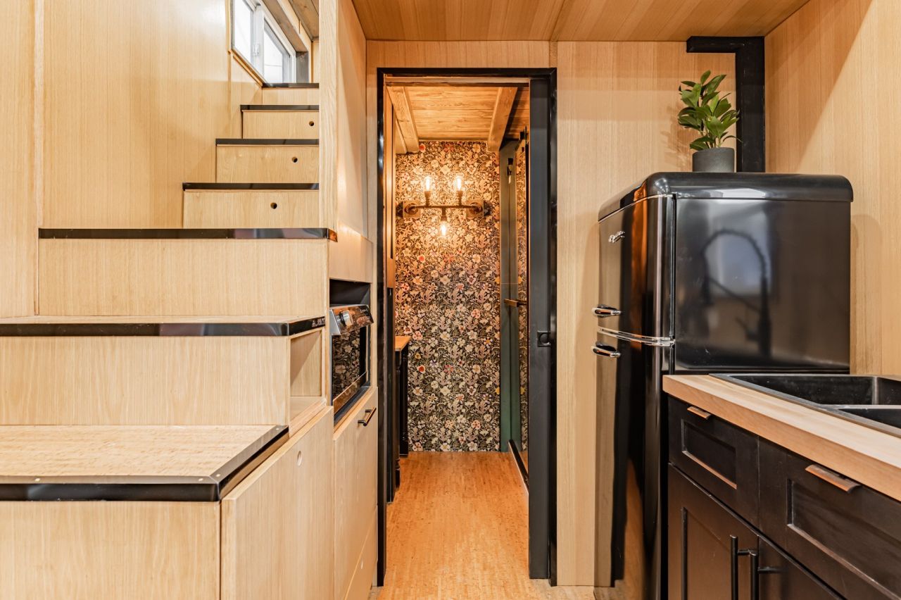 Sherloak Homes Tiny House has Secret Sunroom in 2-Loft Design