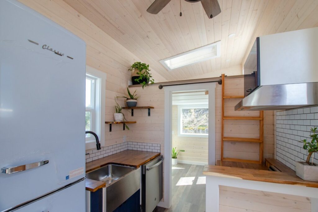 Kitchen leads to master bedroom and loft bedroom