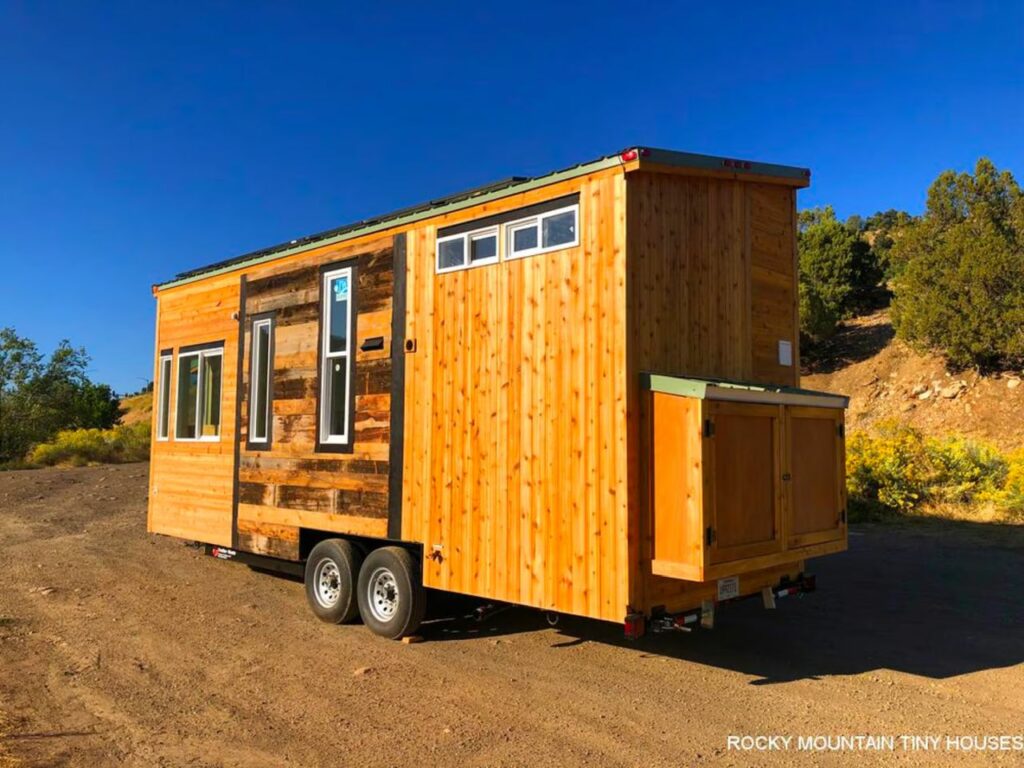 This Rustic Tiny House Features a Drop Down Bed and a Dog Kennel