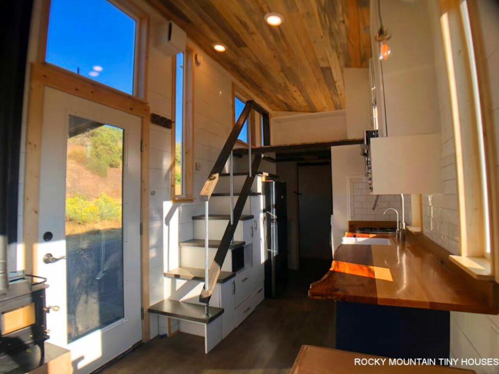 This Rustic Tiny House Features a Drop Down Bed and a Dog Kennel