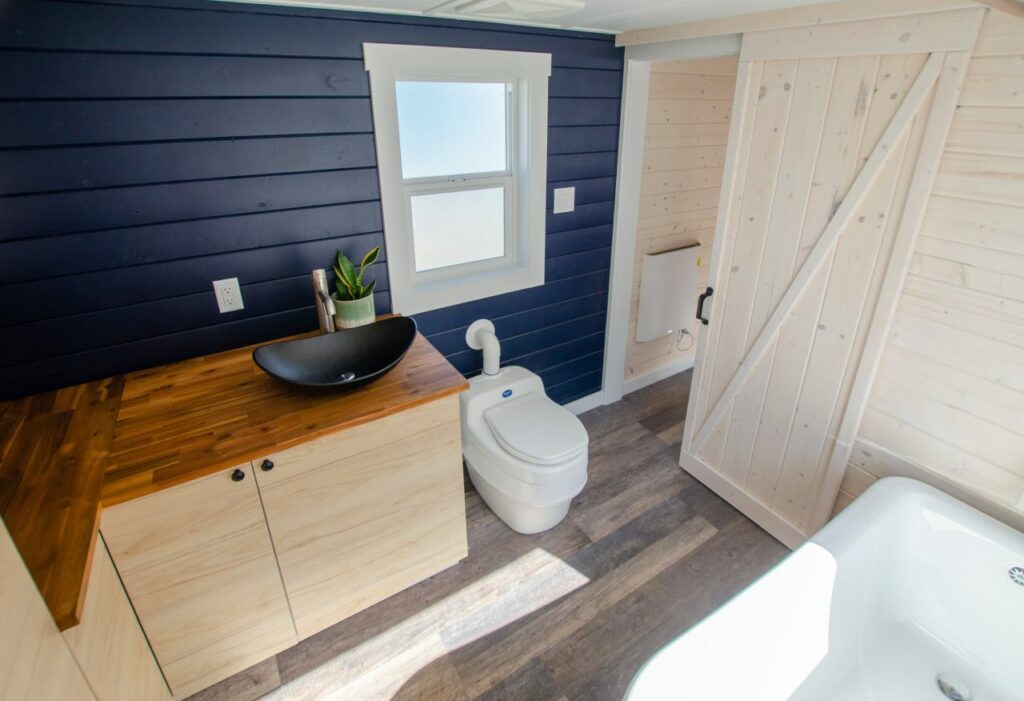 Vanity sink and toilet along with clawfoot bathtub