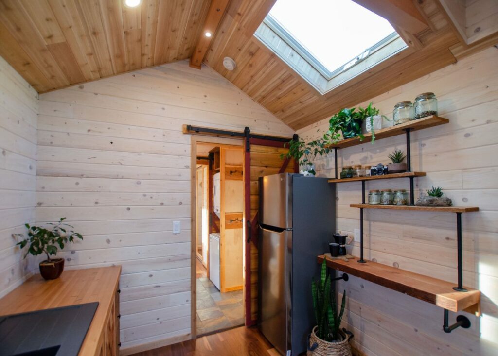 Barndoor leading to bedroom and bathroom