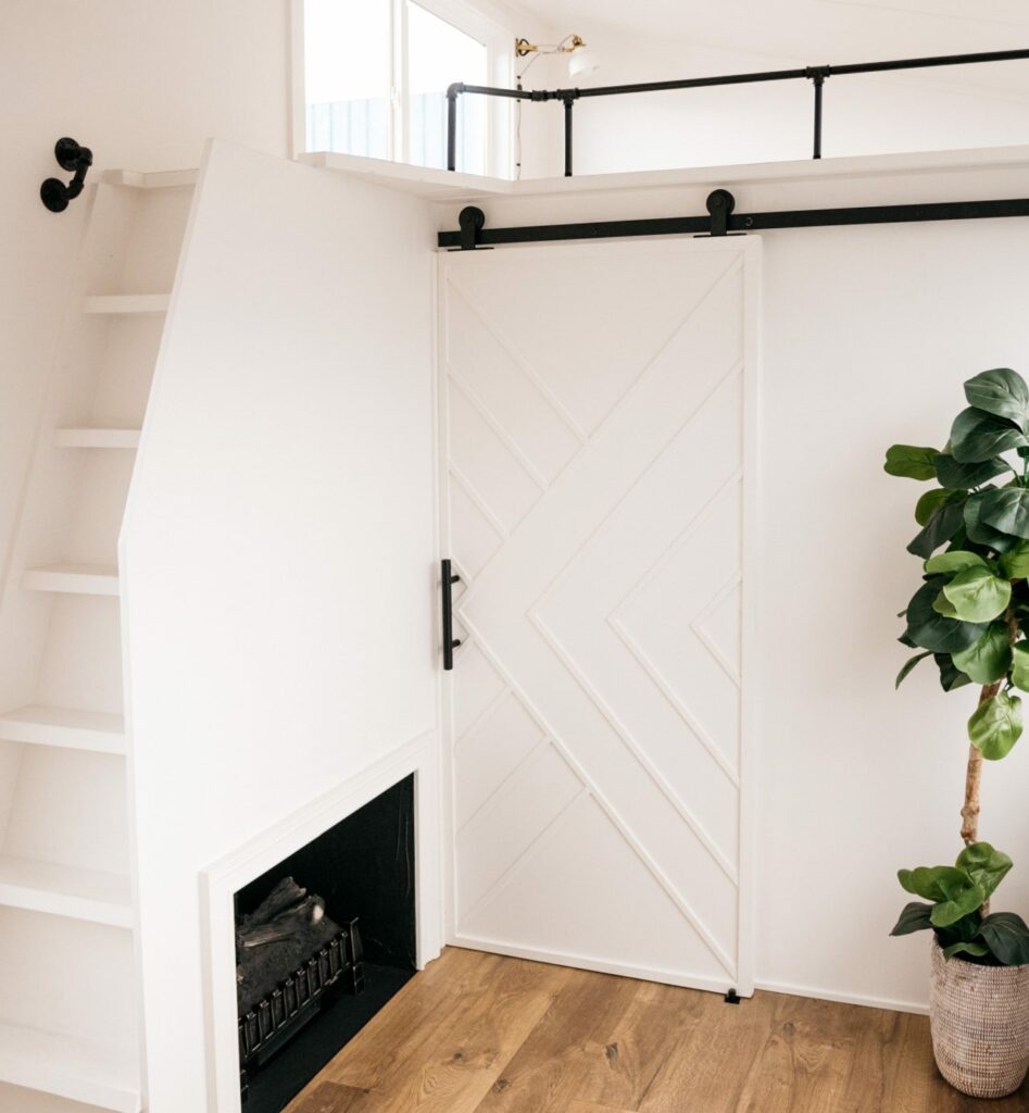 Catalina-Tiny-Home-Fireplace under staircase