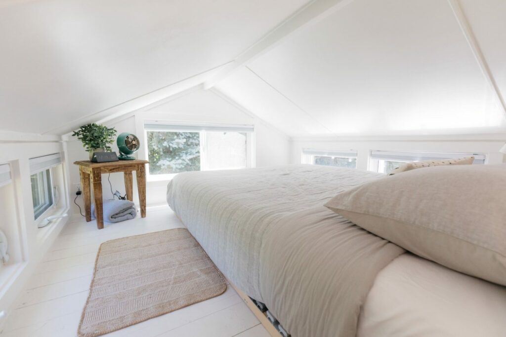 Loft bedroom in Hideaway Tiny House