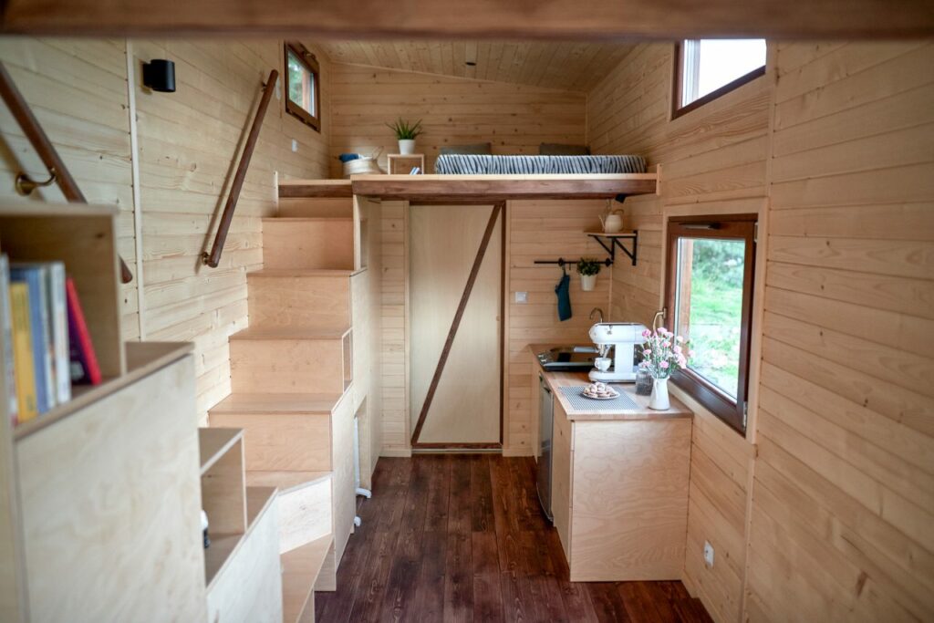 Minimalist Interior of Porto Tiny House with storage integrated dual staircase