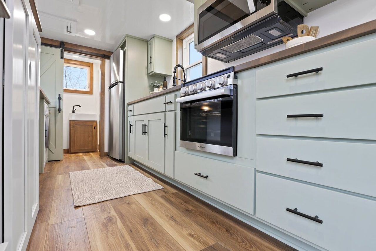 Bofin Tiny House - Mint green cabinets in Kitchen