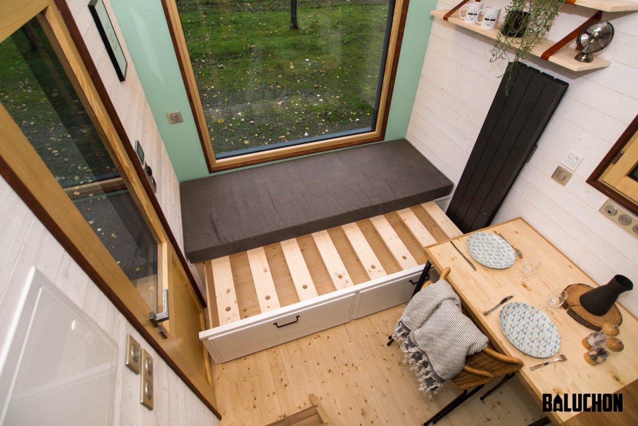 Extendable bed in Living Room of Le Château Ambulant tiny house -1