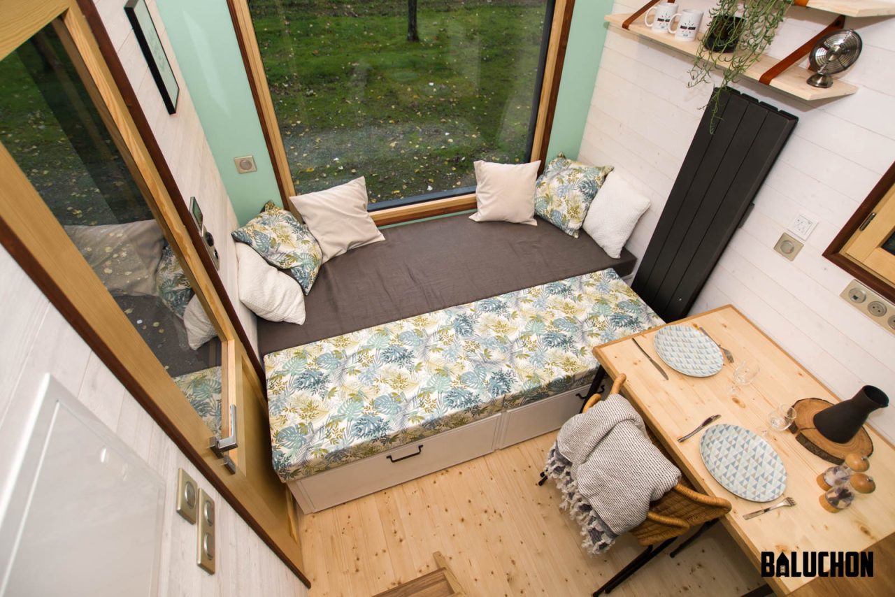 Extendable bed in Living Room of Le Château Ambulant tiny house -2