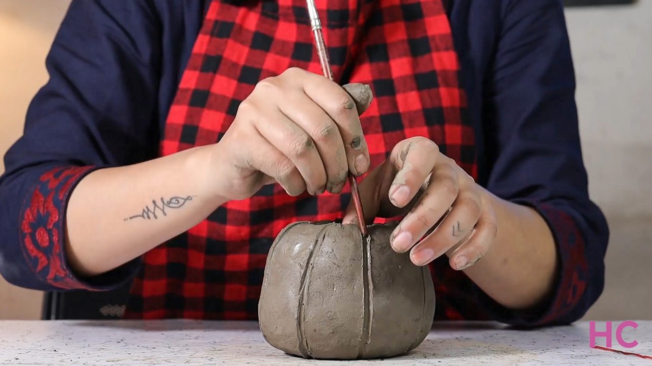 Jack-o-lantern clay candle holder - Create more indentations to mimic a pumpkin - 1