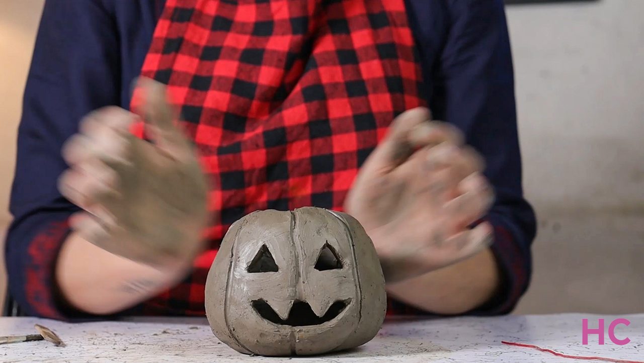 Jack-o-lantern clay candle holder - carved jack-o-lantern