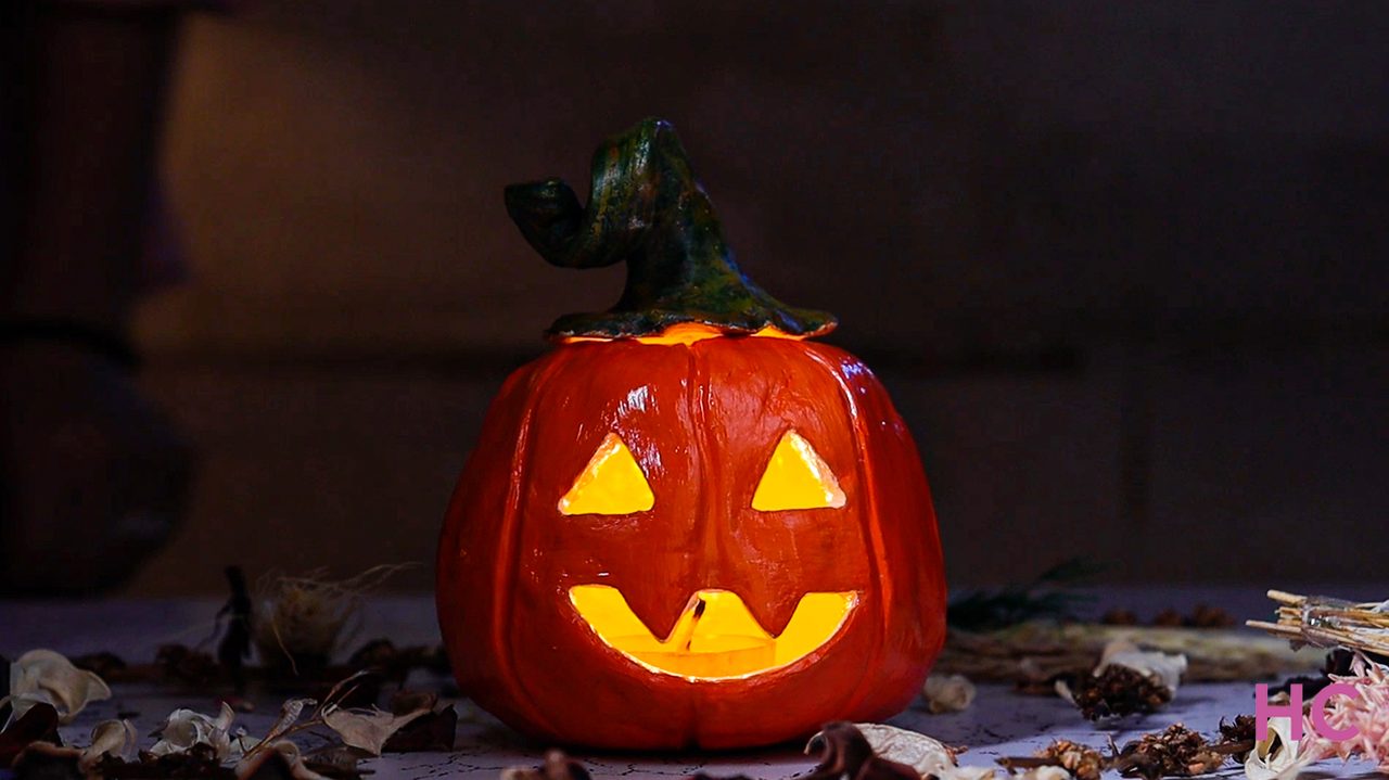 Jack-o-lantern clay candle holder - place a battery-operated tea light