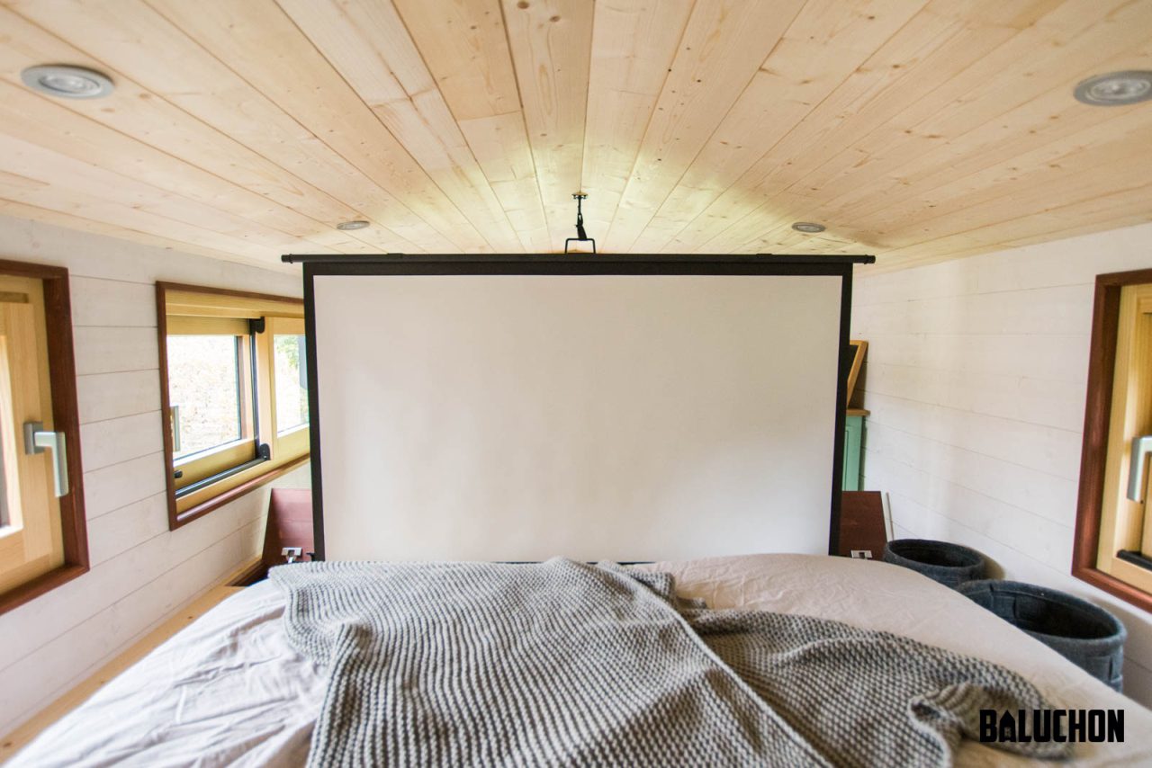 Projector for move nights in bedroom of Le Château Ambulant tiny house