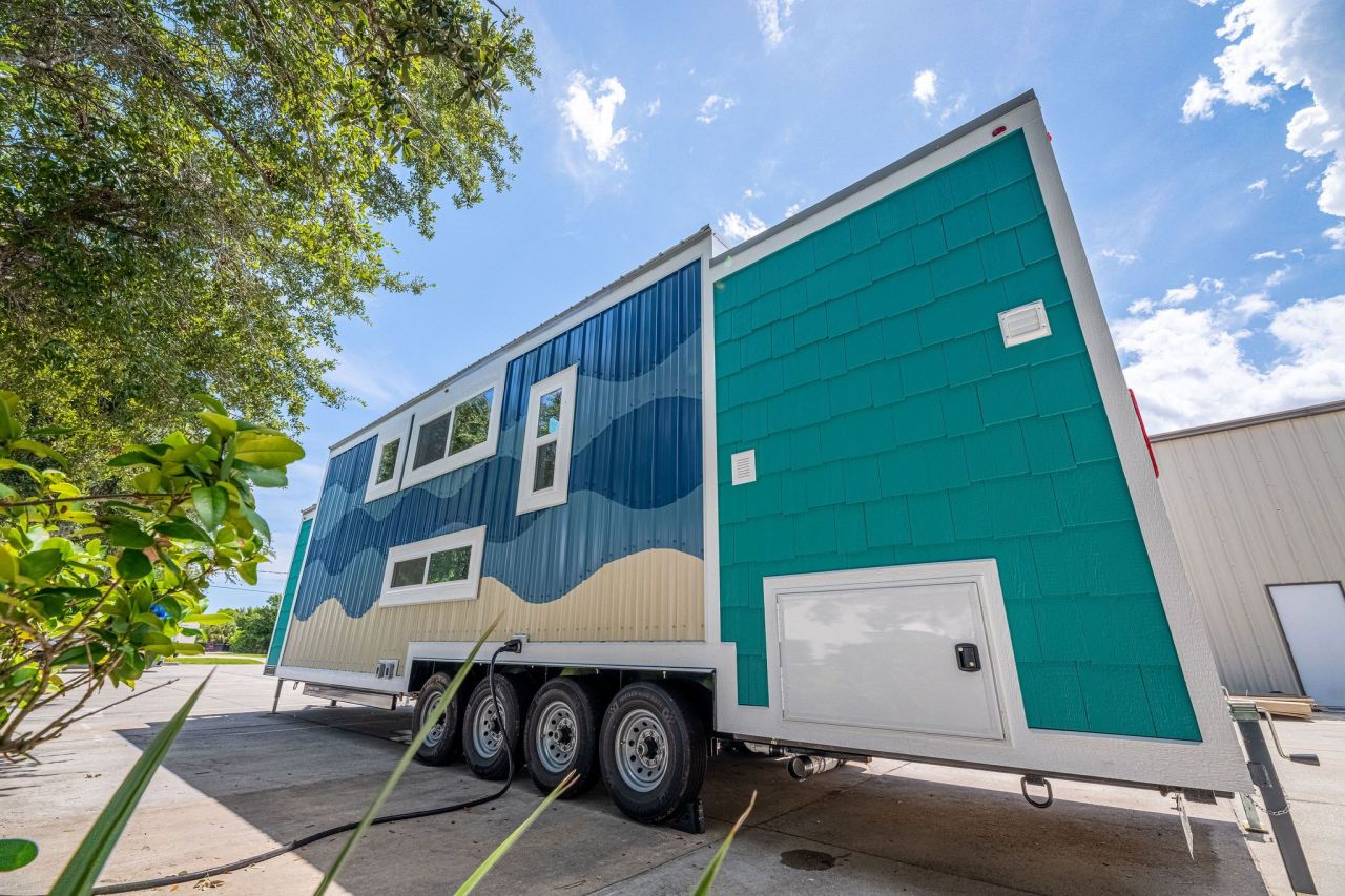 Wave tiny house by Movable Roots Tiny Homes