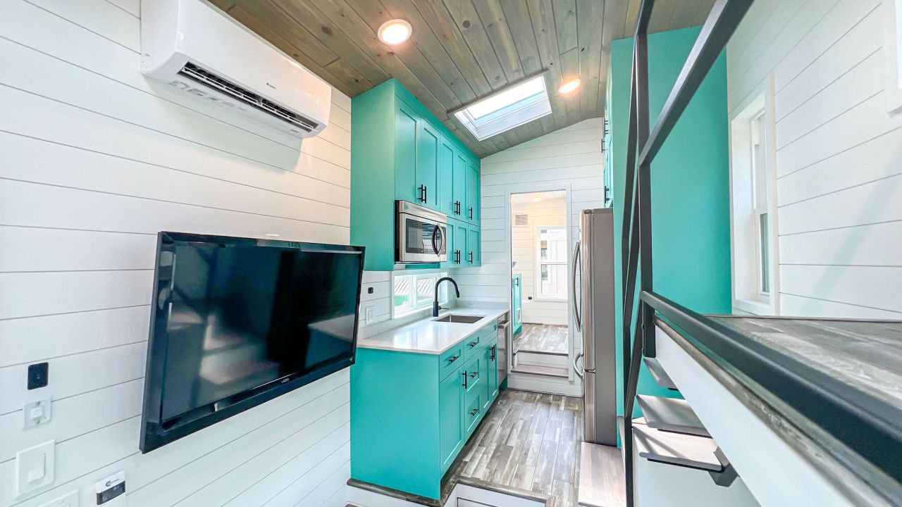 Wave tiny house interior by Movable Roots Tiny Homes