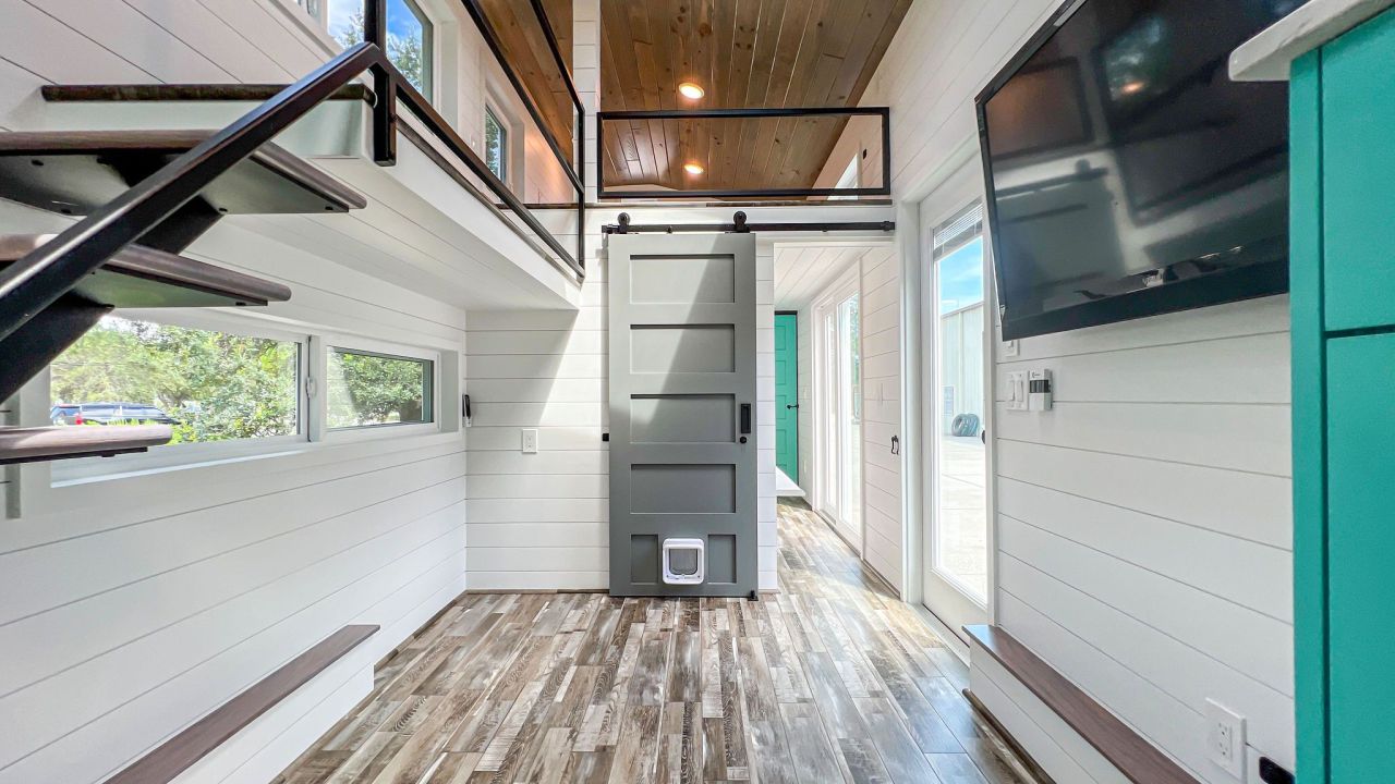 Wave tiny house interior by Movable Roots Tiny Homes