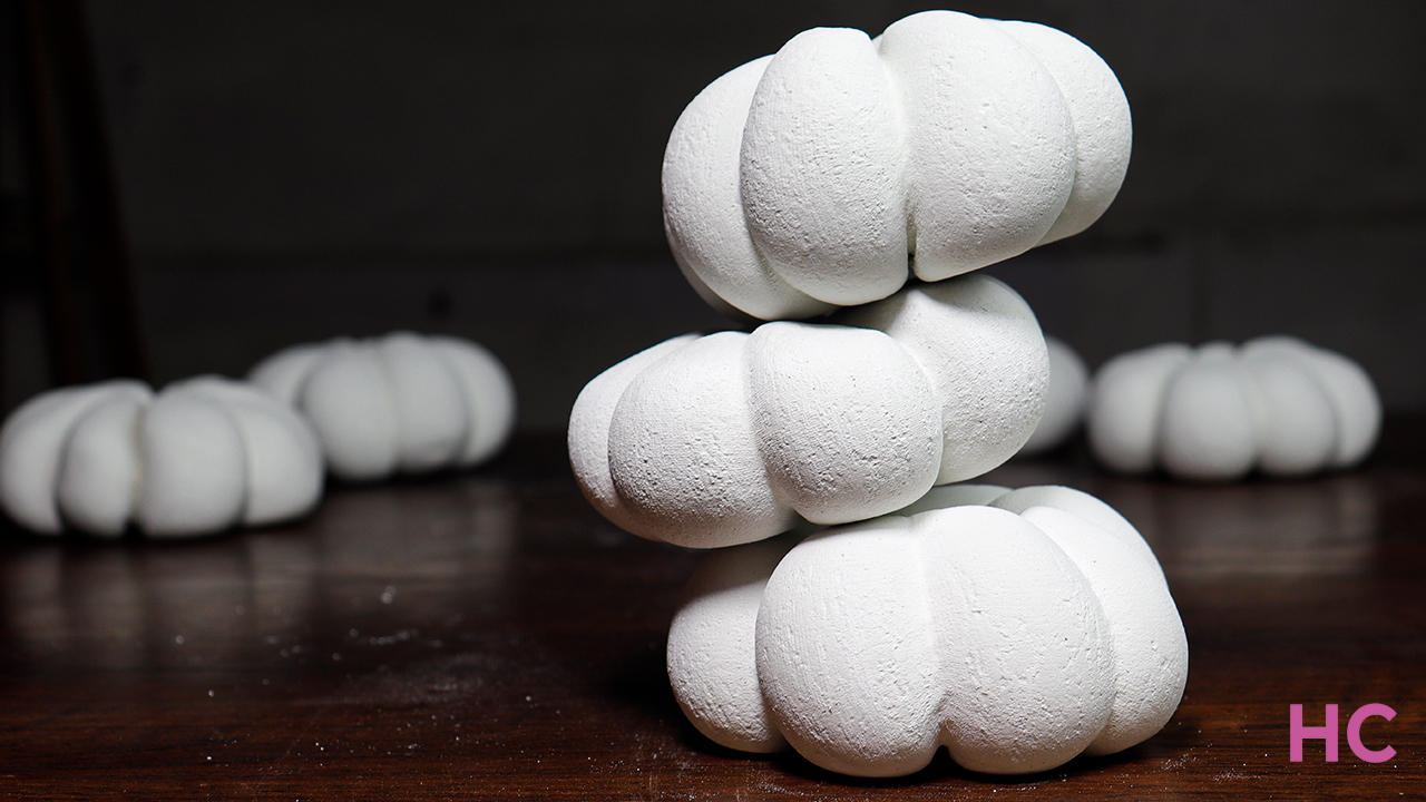 White concrete can be easily turned into cute pumpkins using a sock
