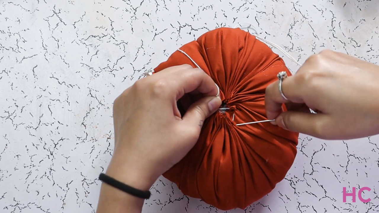 DIY Fabric Pumpkin Tutorial- close the cloth pouch