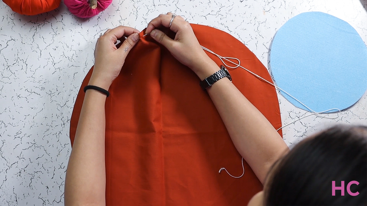 DIY Fabric Pumpkin Tutorial- start stiching the edge of round cloth