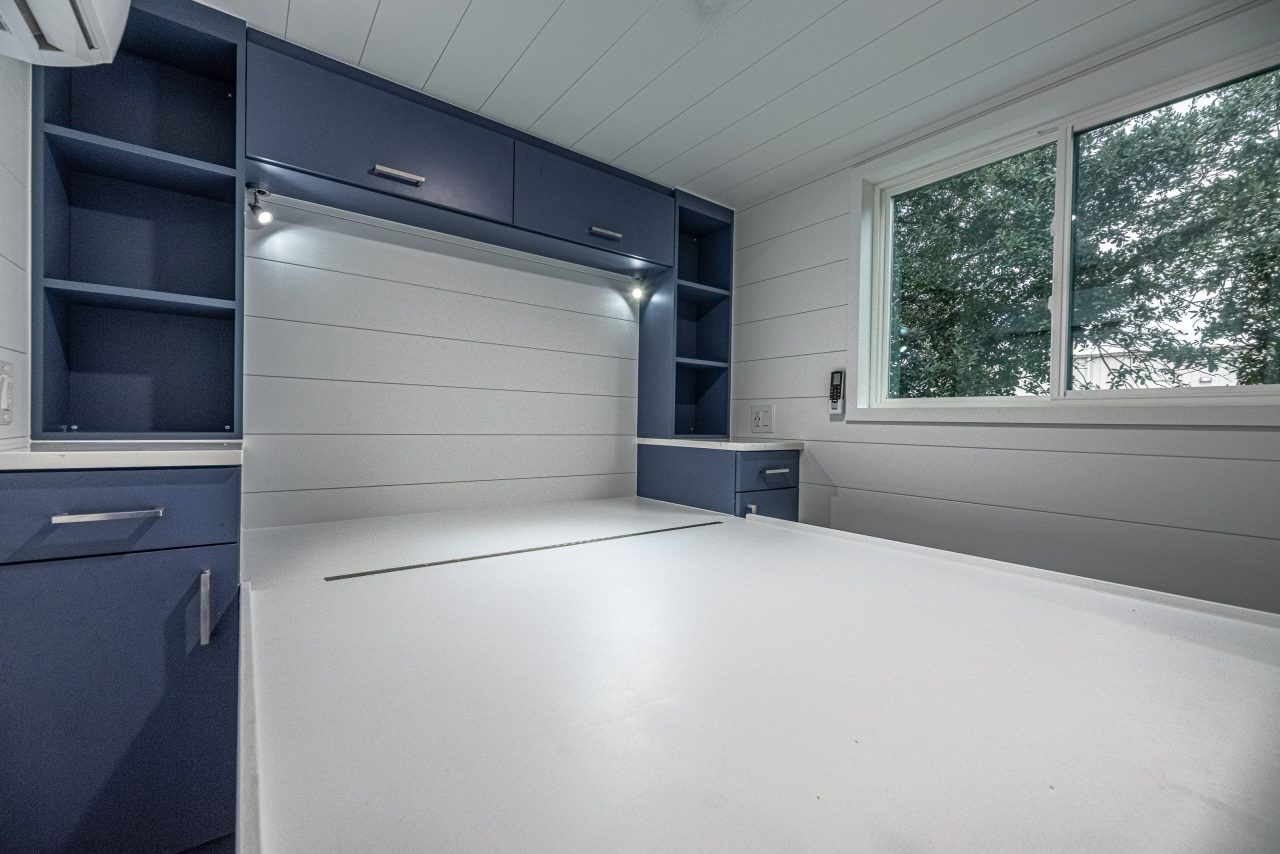 Finale Tiny House - Blue cabinets in ground floor bedroom