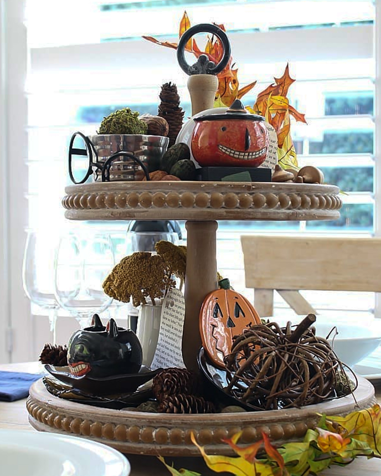 Last minute Halloween tiered tray décor with pinecones and acorns