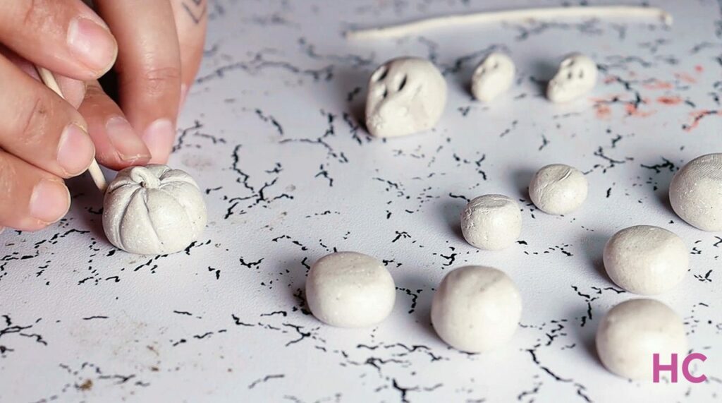 Miniature Clay pumpkins in making for Halloween Graveyard