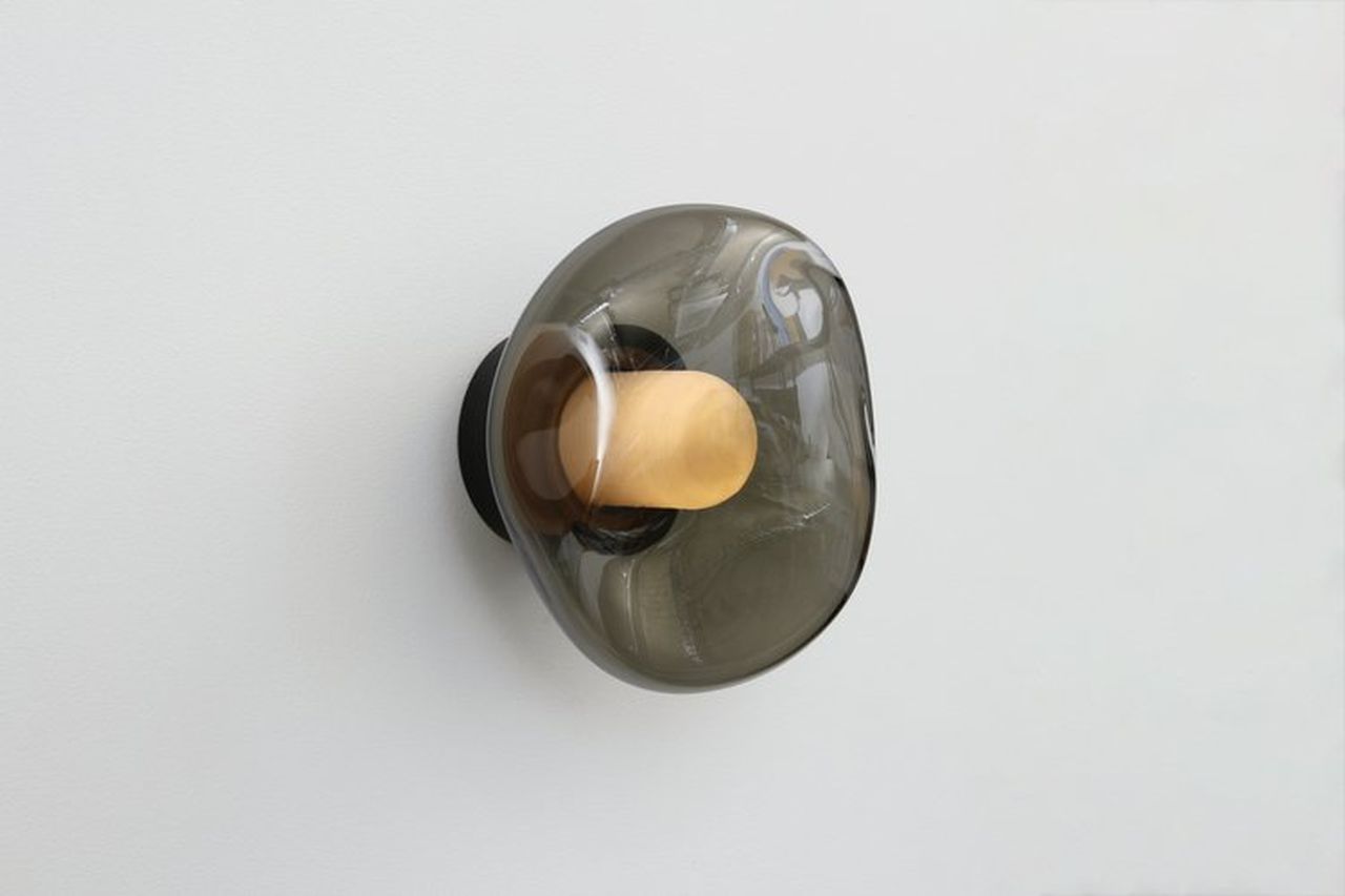 Poke Wall Light has a sphere shaping the outside for a jutting wobbly shape