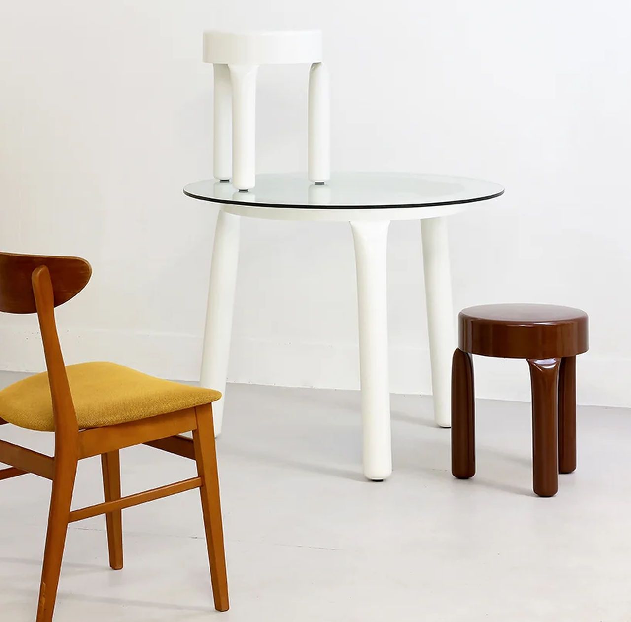 Pressura Stool and Table-share a common three-legged support