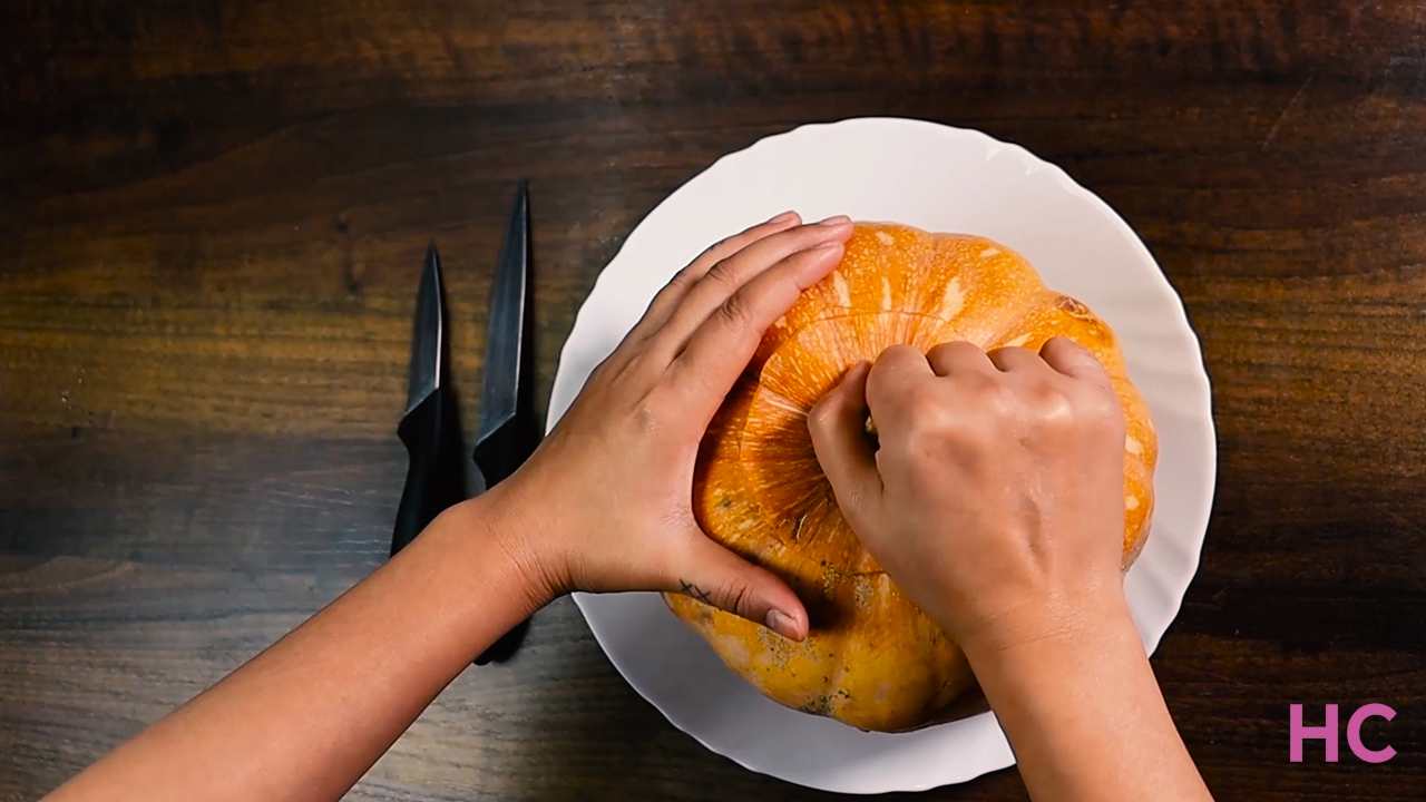 Scary Pumpkin Carving Tutorial for Halloween-- remove the top of pumpkin