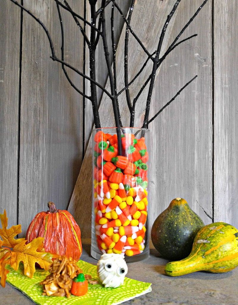 Vase filled with candy corn makes a great Halloween centerpiece
