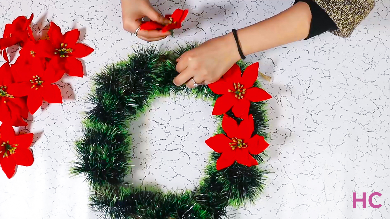 Christmas Poinsettia Wreath Tutorial - Stick flowers inside wreath