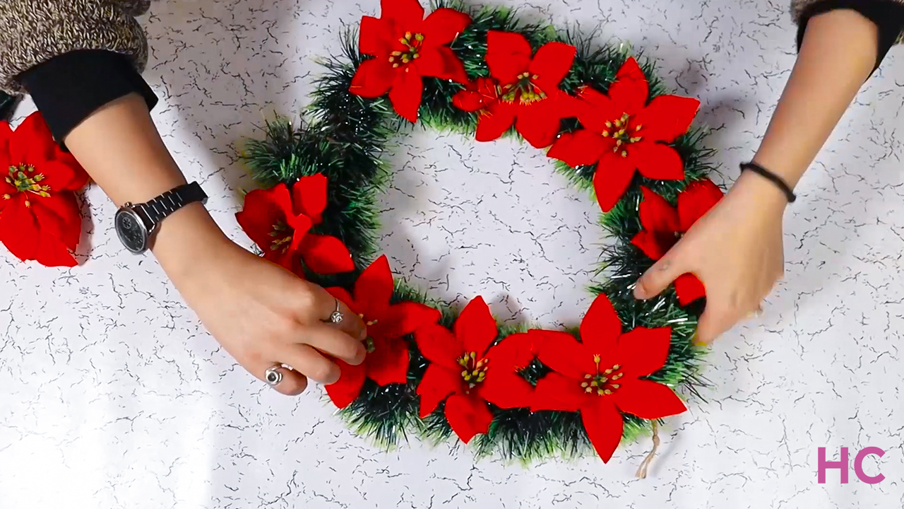 Christmas Poinsettia Wreath - cover the wreath with flowers