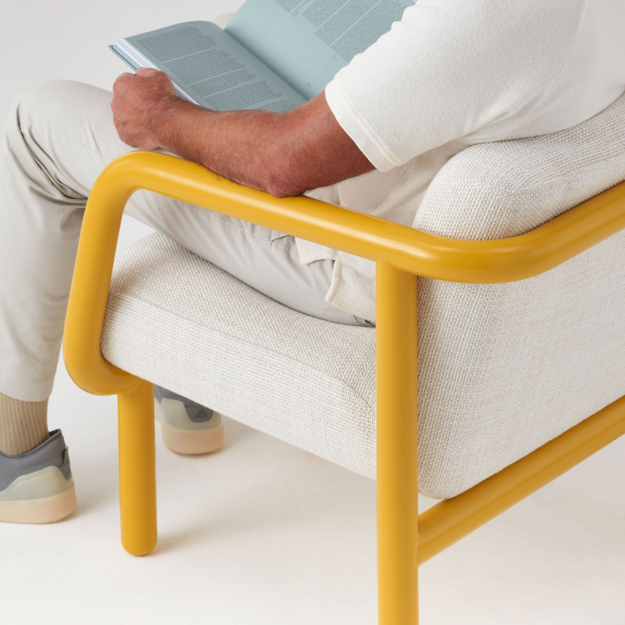 Percy Lounge Chair displays plush cushioned upholstery