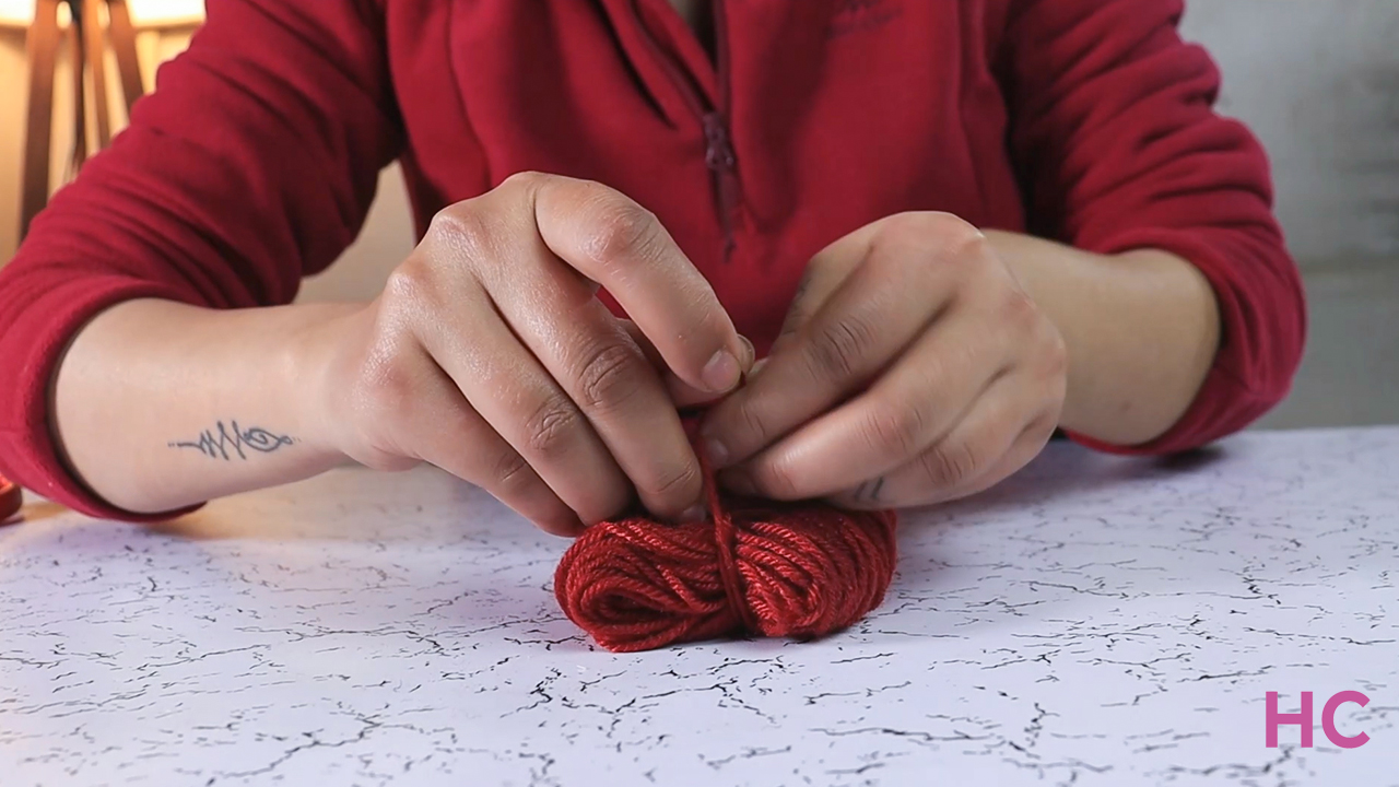 Pom Pom Christmas Wreath -remove the skein and tie in middle