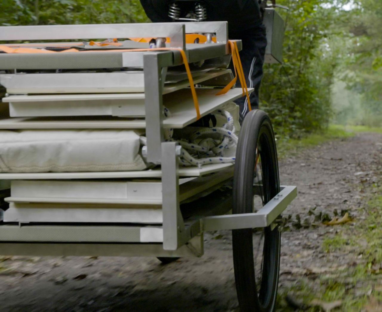 Trunk-Bunk-treehouse towed by a bike