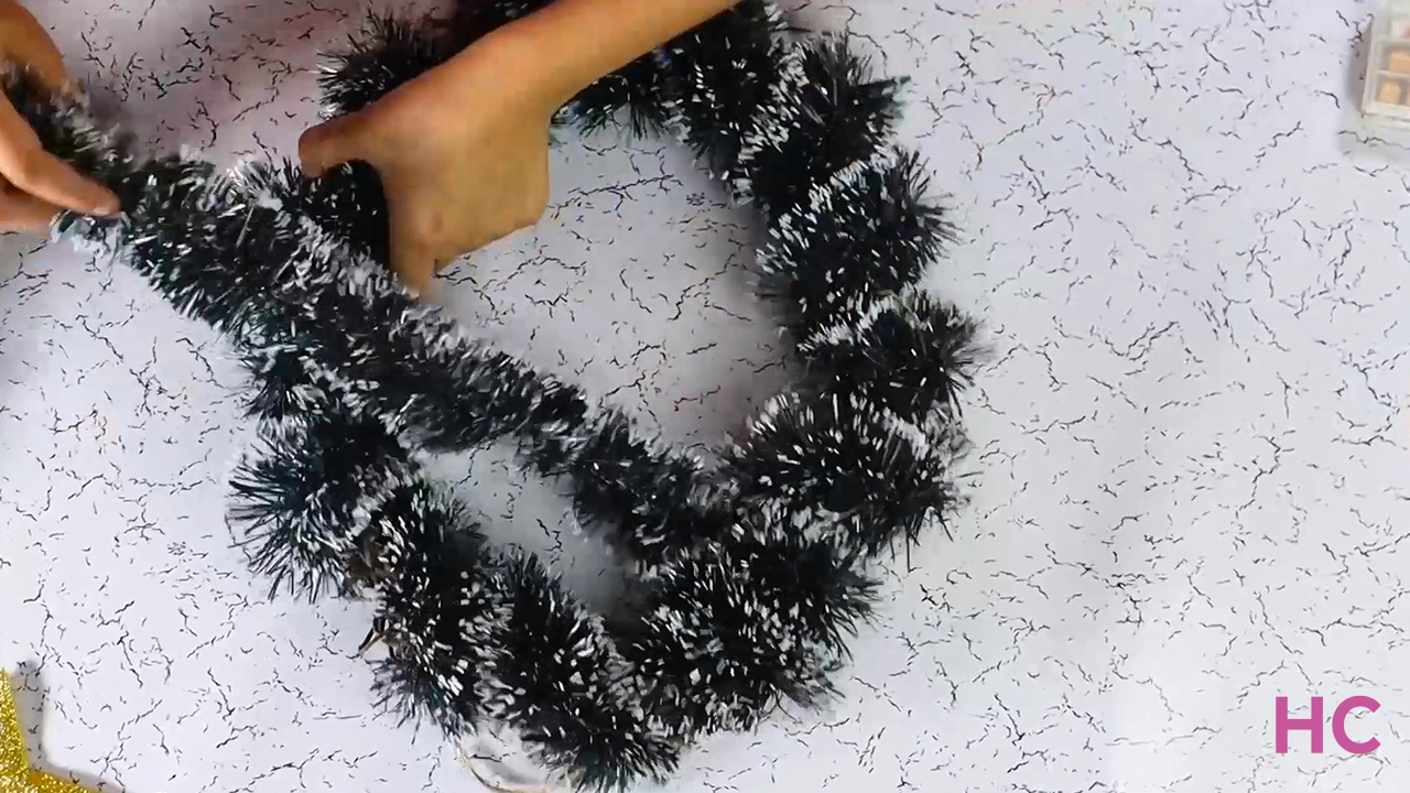 Wrap wreath in garland for DIY Christmas Tree Wreath