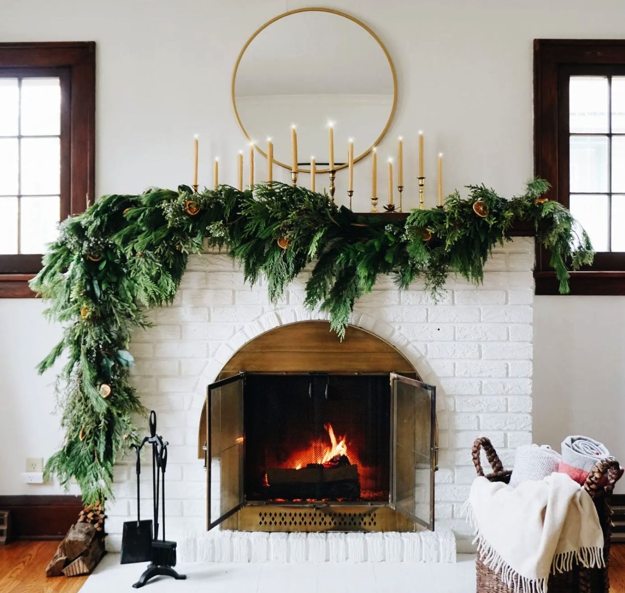 Christmas Fireplace mantel Decoration ideas - asymmetrical garland and candles