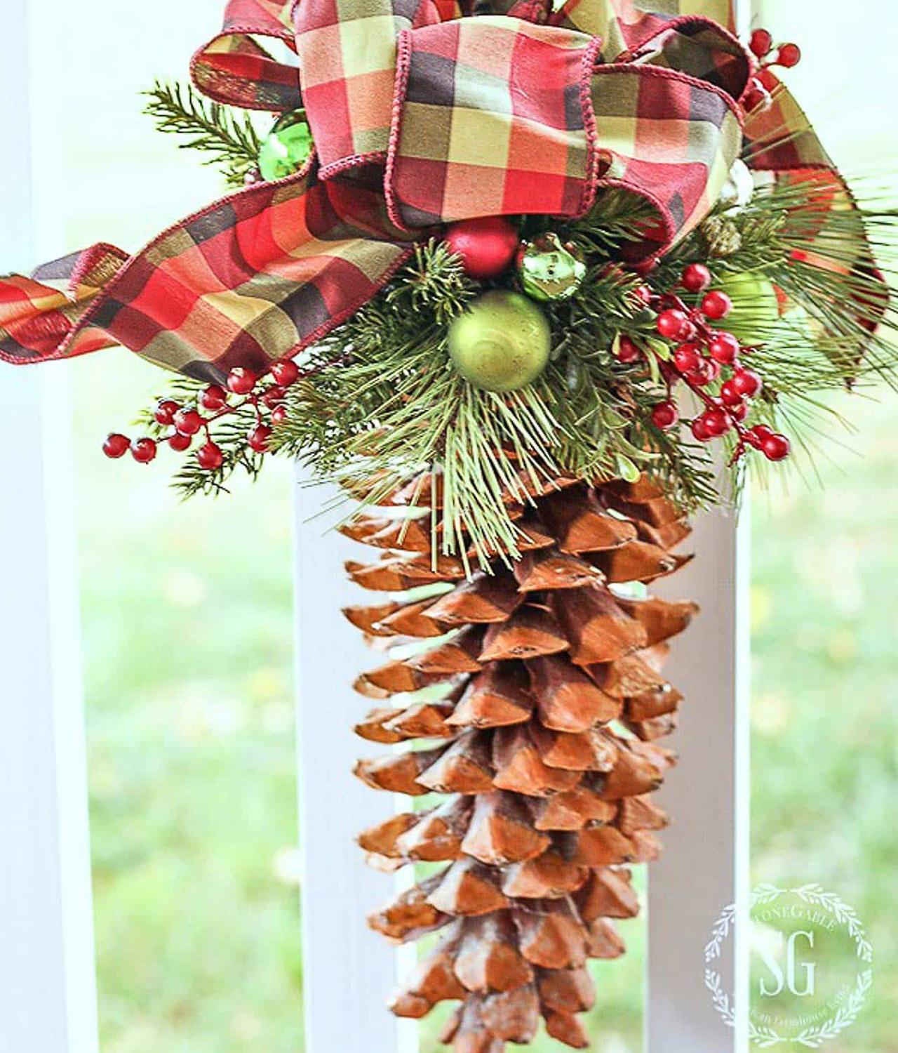 Crafty Hanging Pinecone Ornament for Window Using a Large Plaid Bow