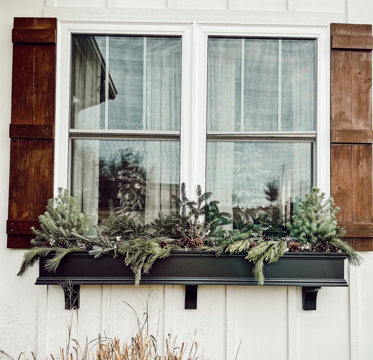 Easy Christmas Window Decoration Ideas - window box with foliage