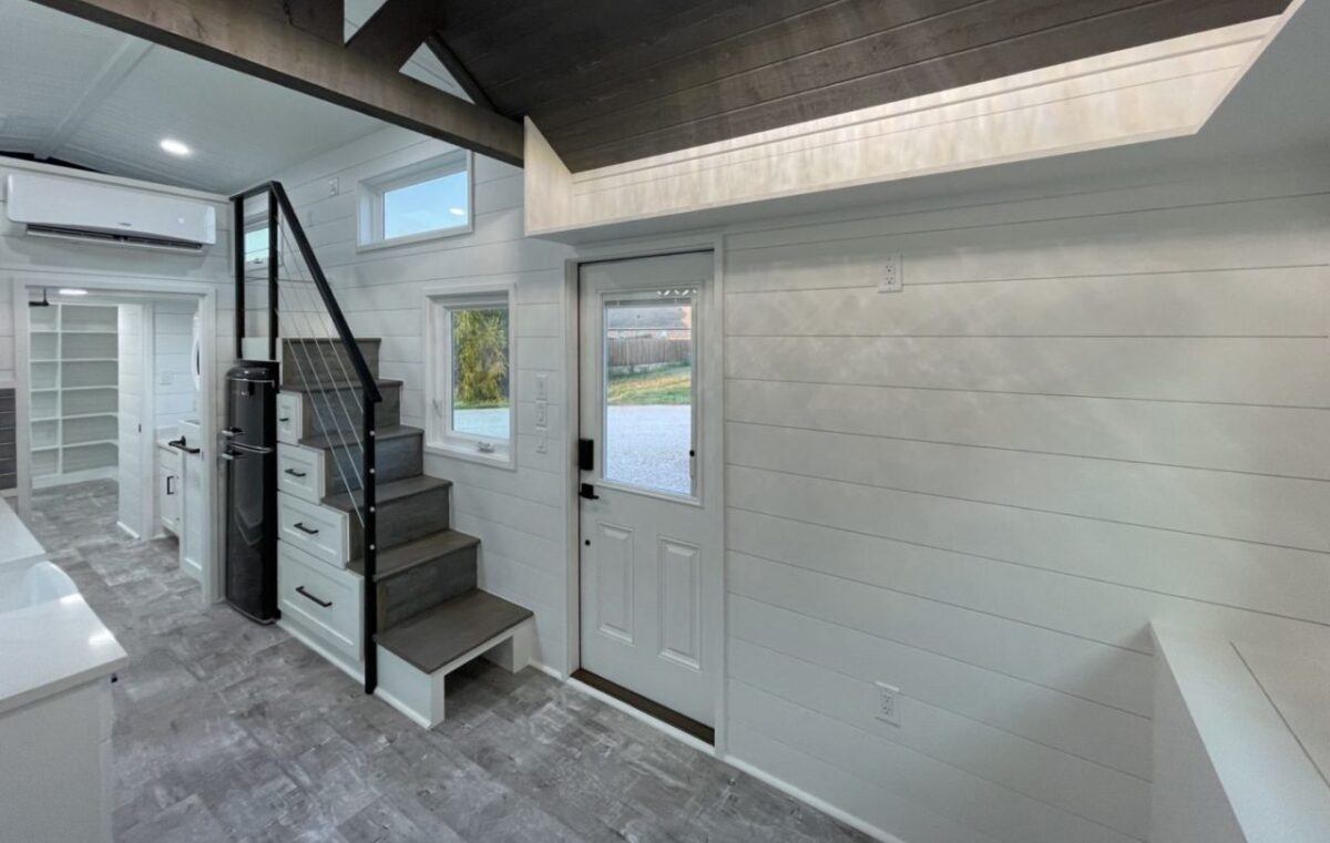 Alexandria Tiny House Features Library-Style Shelves in Bedroom